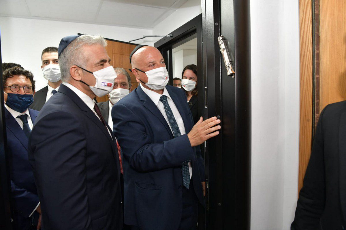 Israeli Foreign Minister Yair Lapid (L) attends the opening ceremony of the diplomatic mission office with the attendance of Israel interim Chief of Diplomatic Mission in Morocco, Ambassador David Govrin (R) in Rabat, Morocco on 12 August 2021. [Israeli Foreign Ministry / Handout - Anadolu Agency]