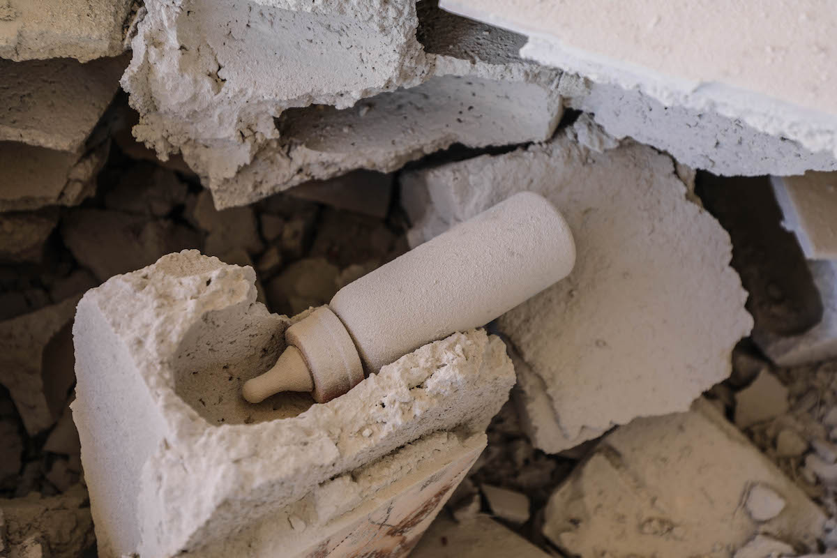A nursing bottle is seen among the debris after shelling by the Assad regime and Iranian-affiliated terror groups, in breach of a truce in Kansafra village, de-escalation zone Idlib, Syria on 20 August 2021. [Izzeddin Kasim - Anadolu Agency]