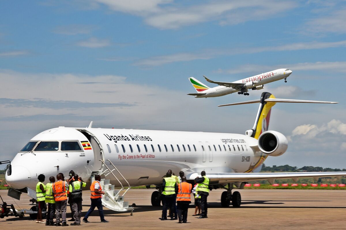 Ground crew prepare a Uganda Airlines Bombadier aircraft in Nairobi on August 27, 2019 [ISAAC KASAMANI/AFP via Getty Images]