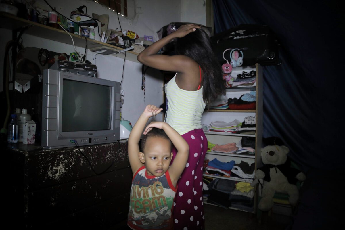 Theresa, a 33-year-old migrant worker from Kenya with her son Christiano on August 14, 2020 [Elsie Haddad/Getty Images]