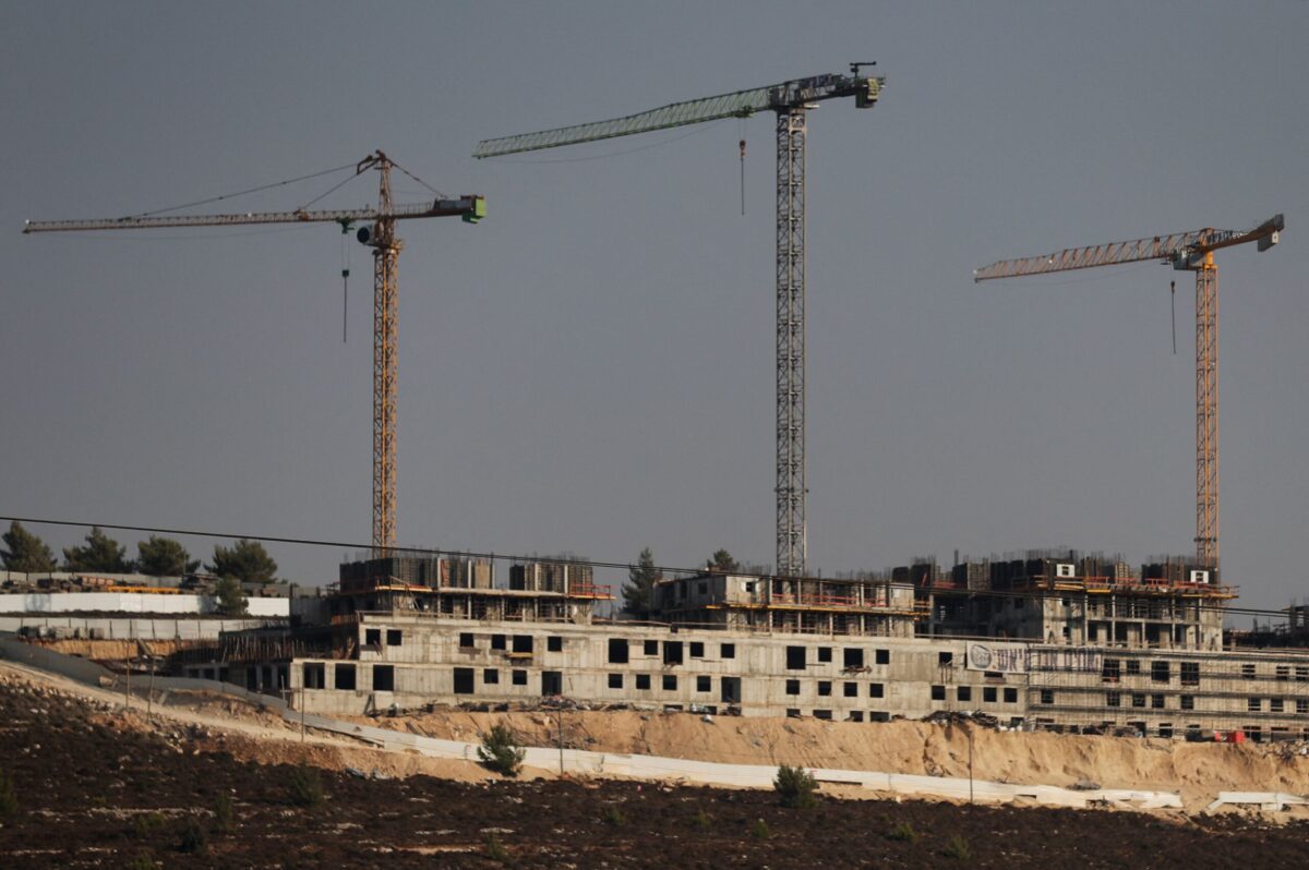 A picture taken on August 26,2021 shows construction works in the Jewish settlement of Givat Zeev, near the Israeli-occupied West Bank city of Ramallah [AHMAD GHARABLI/AFP via Getty Images]