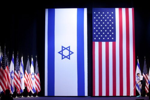 Israeli and US flags are seen in Jerusalem on 21 March 2019 [Uriel Sinai/Getty Images]