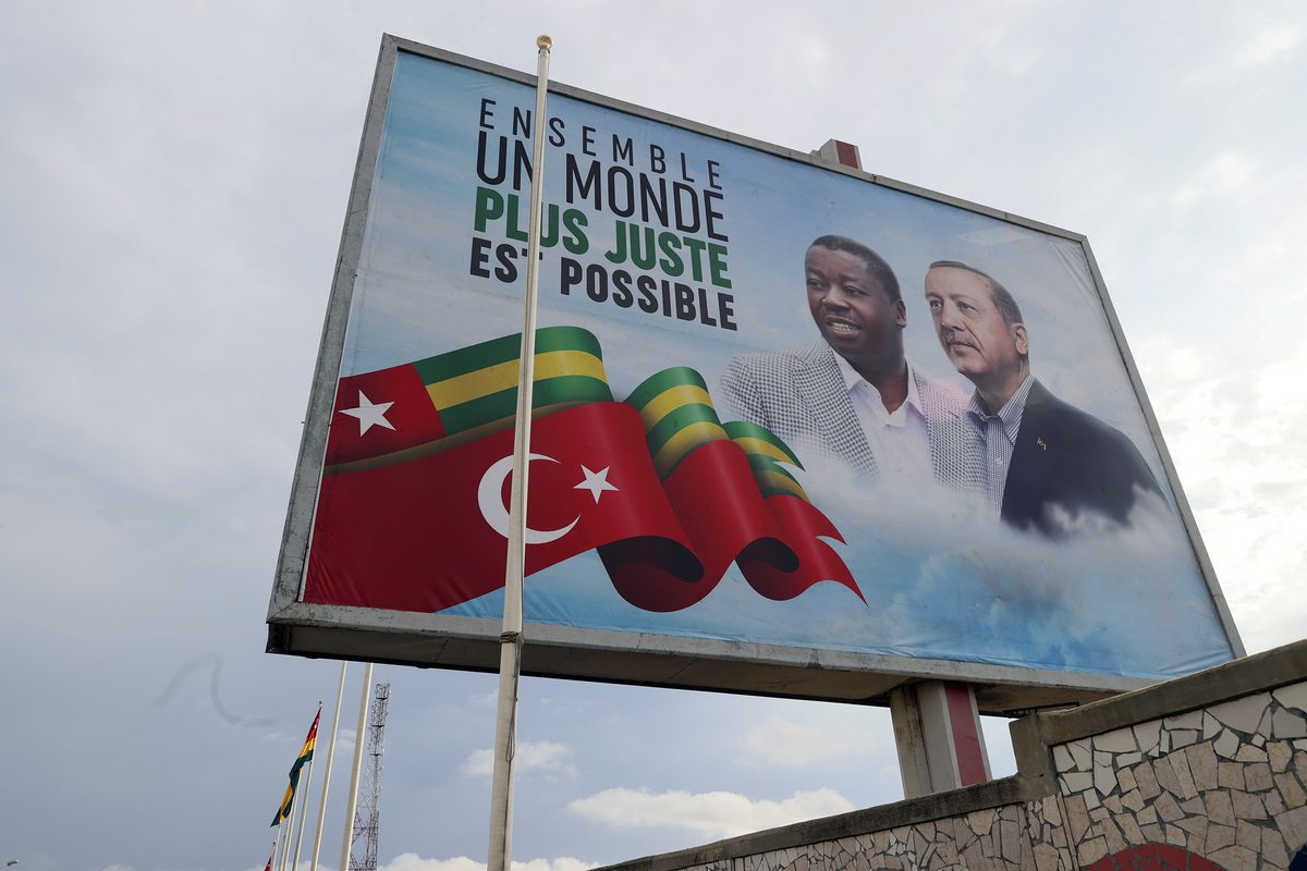 A photo shows a billboard with the photo of Turkish President Recep Tayyip Erdogan and Togolese President Faure Essozimna Gnassingbe at a street ahead of Turkish President Recep Tayyip Erdogan's visit in Lome, Togo on October 18, 2021 [Halil Sağırkaya/Anadolu Agency]