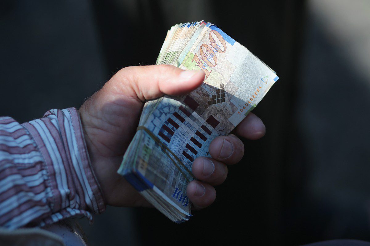 Israeli shekels. [Christopher Furlong/Getty Images]