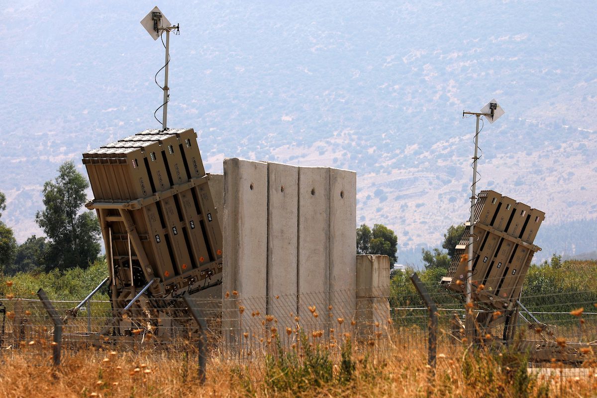 A picture taken on August 5, 2021, shows an Iron Dome defense system battery, designed to intercept and destroy incoming short-range rockets and artillery shells, in the Hula Valley in northern Israel near the border with Lebanon. [JALAA MAREY/AFP via Getty Images]