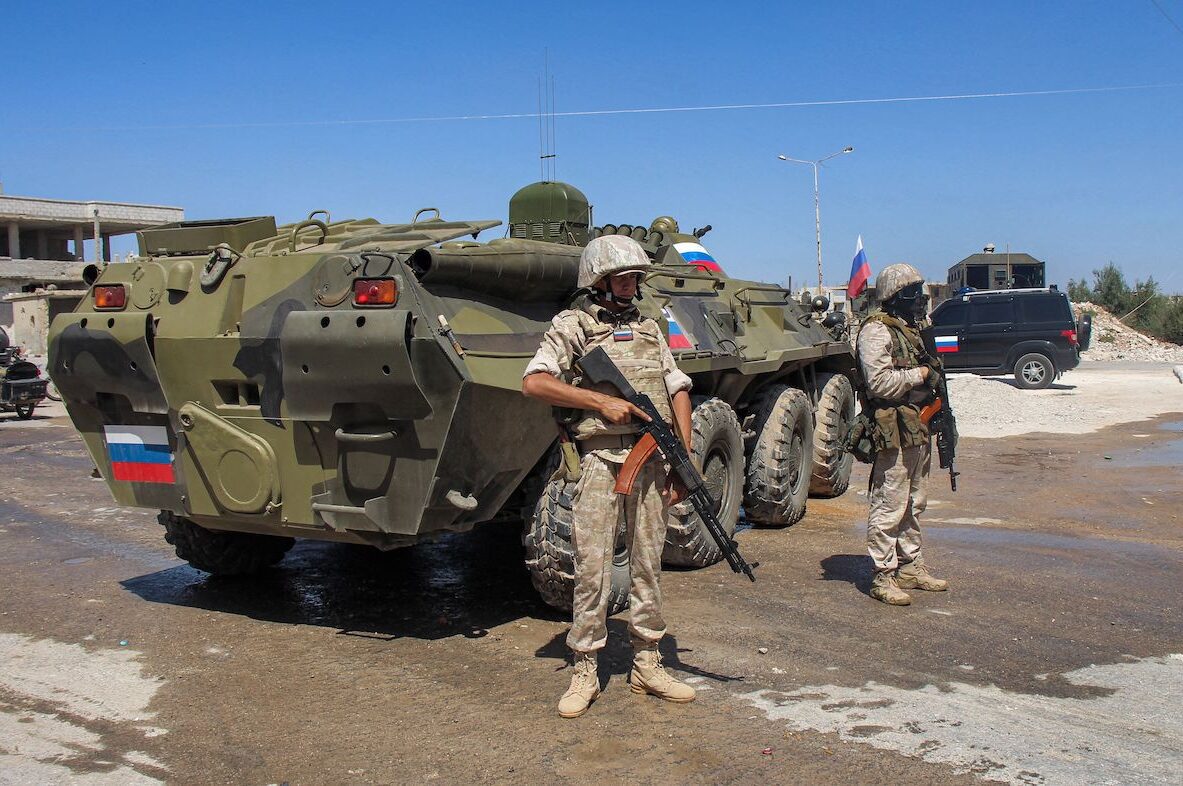 Russian soldiers stand by an armoured personnel carrier (APC) in the Syrian rebel-held Daraa al-Balad district of the southern city of Daraa on 6 September 2021 [SAM HARIRI/AFP via Getty Images]