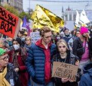 People take part in a protest rally in solidarity with migrants who have been pushed back at Poland's border with Belarus in Warsaw, October 17, 2021. Placard reads "No one is illegal" - Thousands of people demonstrated in Warsaw against pushbacks of migrants at the Polish-Belarusian border. Demonstrators marched through the Polish capital's centre bearing signs like "Stop torture at the border" and "Nobody is illegal". (Photo by Wojtek RADWANSKI / AFP) (Photo by WOJTEK RADWANSKI/AFP via Getty Images)