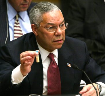 Then US Secretary of State Colin Powell holds a vial representing the small amount of Anthrax at the UN Security Council February 5, 2003 in New York City [Mario Tama/Getty Images]