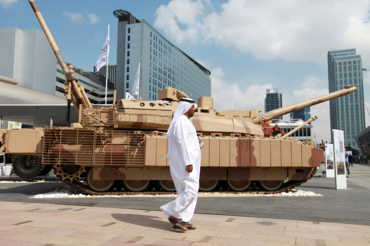An Arab visitor walks past a battle tank displayed outside the International Defence Exhibition (IDEX) in Abu Dhabi, United Arab Emirates, on Monday, Feb. 23, 2015 [Gabriela Maj/Bloomberg via Getty Images]