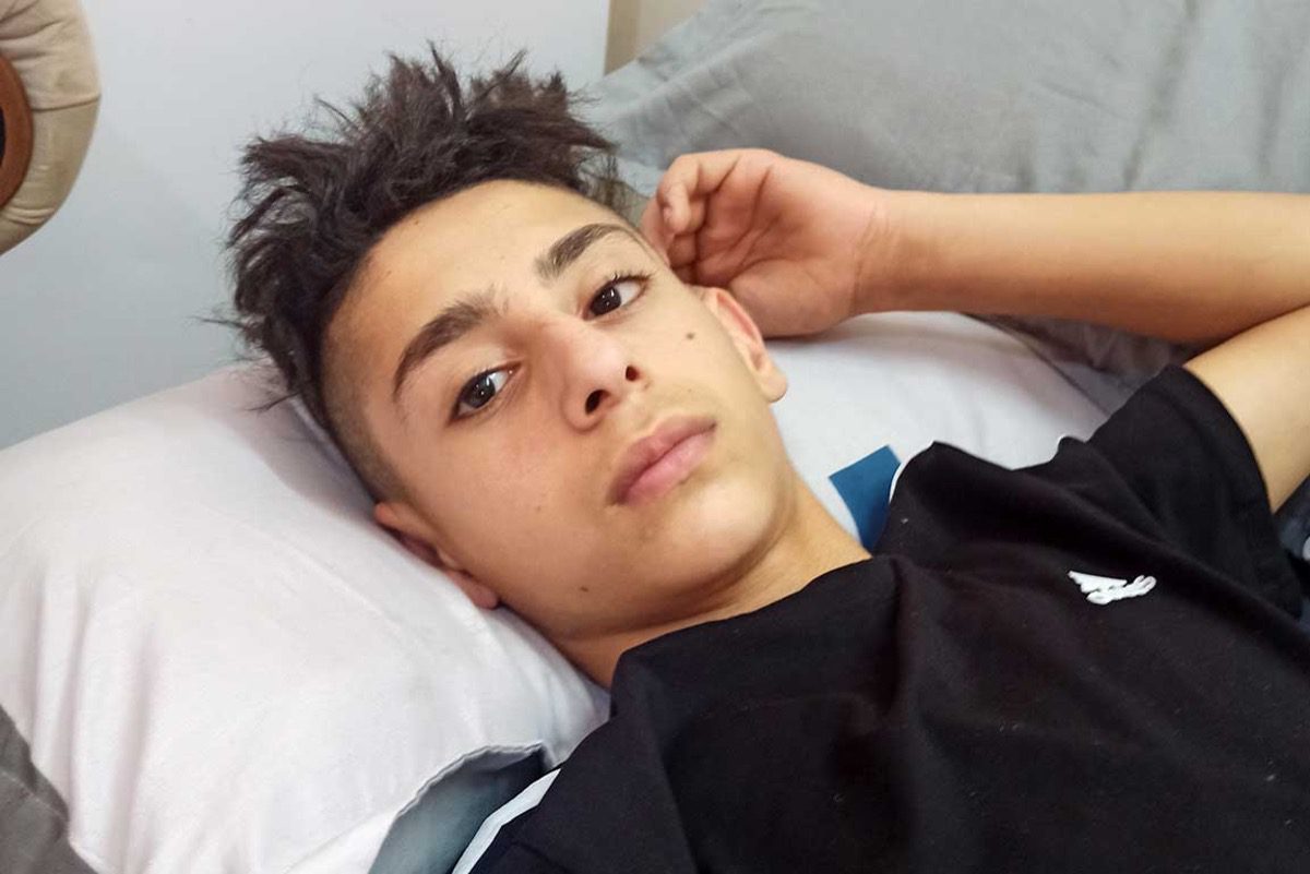 15-year-old Tareq Zbeidi at the hospital [B'Tselem]