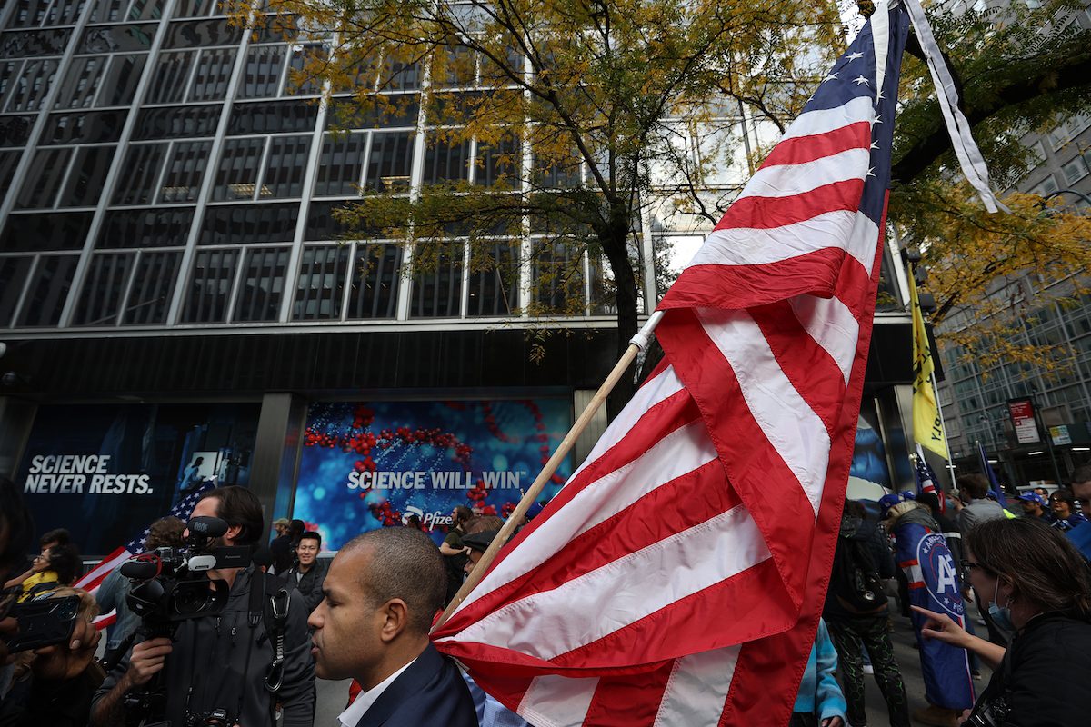 Pfizer Protest NEW YORK, NY – NOVEMBER 13: America First supporters and anti ...