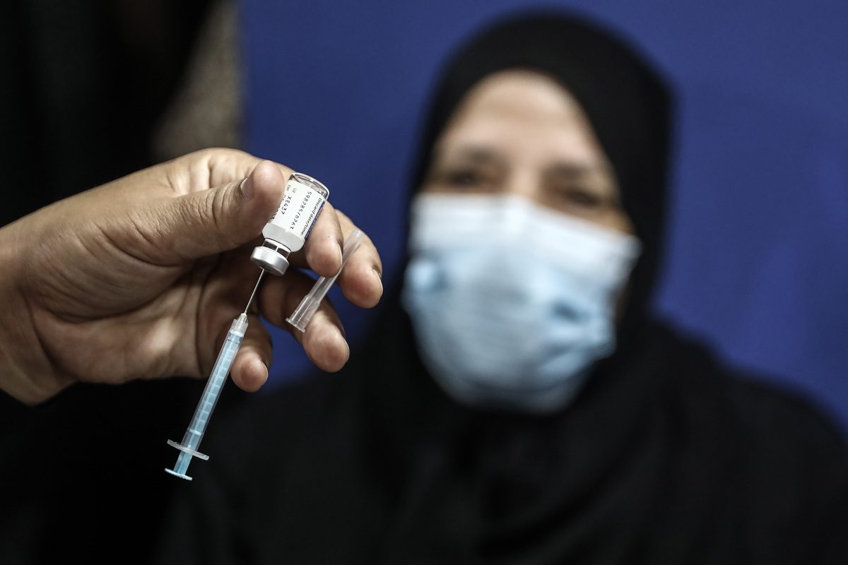 People receive Covid-19 vaccine in a health centre in Cairo, Egypt on 15 November 2021 [Stringer/Anadolu Agency]