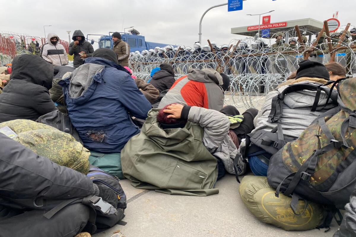 Migrants are seen following their arrival at the Polish-Belarusian border on 15 November 2021 [Stringer/Anadolu Agency]