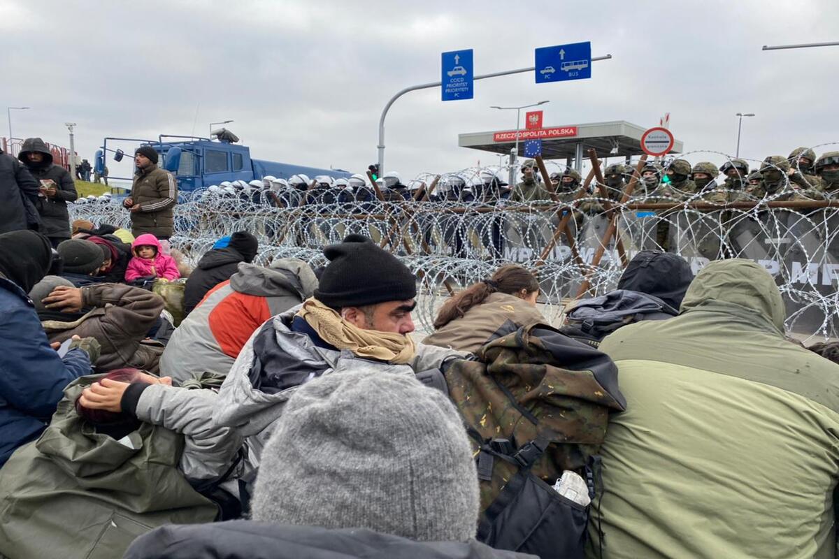 BELARUS - NOVEMBER 15: Irregular migrants with new irregular migrant groups are seen following their arrival at the border line and they continue to wait at the Polish-Belarusian border during cold weather on November 15, 2021 in Belarus. A group of migrants including children and women stormed into Poland through the Belarusian border, the Belarusian State Border Committee said on Saturday. Most of them who came to Belarus with a visa from Iraq continue to wait at Belarus' Bruzgi border point in Grodno despite cold weather conditions. The committee said a group of about 100 people passed through the Bruzgi-Kuznitsa border point to the Polish side, adding that these people are on the Polish territory and waiting near the barbed fence installed by the Polish side. ( Stringer - Anadolu Agency )