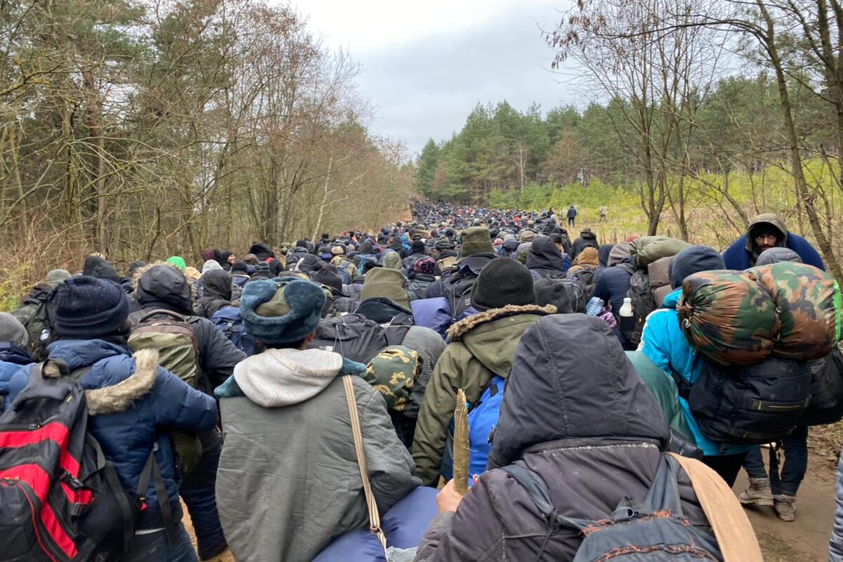 Migrants are seen following their arrival at the Polish-Belarusian border on 15 November 2021 [Stringer/Anadolu Agency]