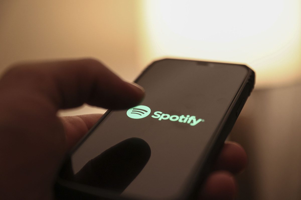 In this photo illustration, a mobile phone screen displays the logo of "Spotify" [Raşit Aydoğan - Anadolu Agency]