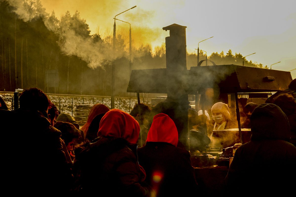 GRODNO REGION, BELARUS - NOVEMBER 28: Migrants continue to wait at a closed area allocated by Belarusian government the Belarusian-Polish border in Grodno, Belarus on November 28, 2021. The migrant crisis on the border of Belarus with Poland, Lithuania, and Latvia escalated on November 8. This year, Polish border guards have prevented more than 35,000 attempts to illegally cross the Polish-Belarusian border, which is 400 times more than last year. ( Sefa Karacan - Anadolu Agency )