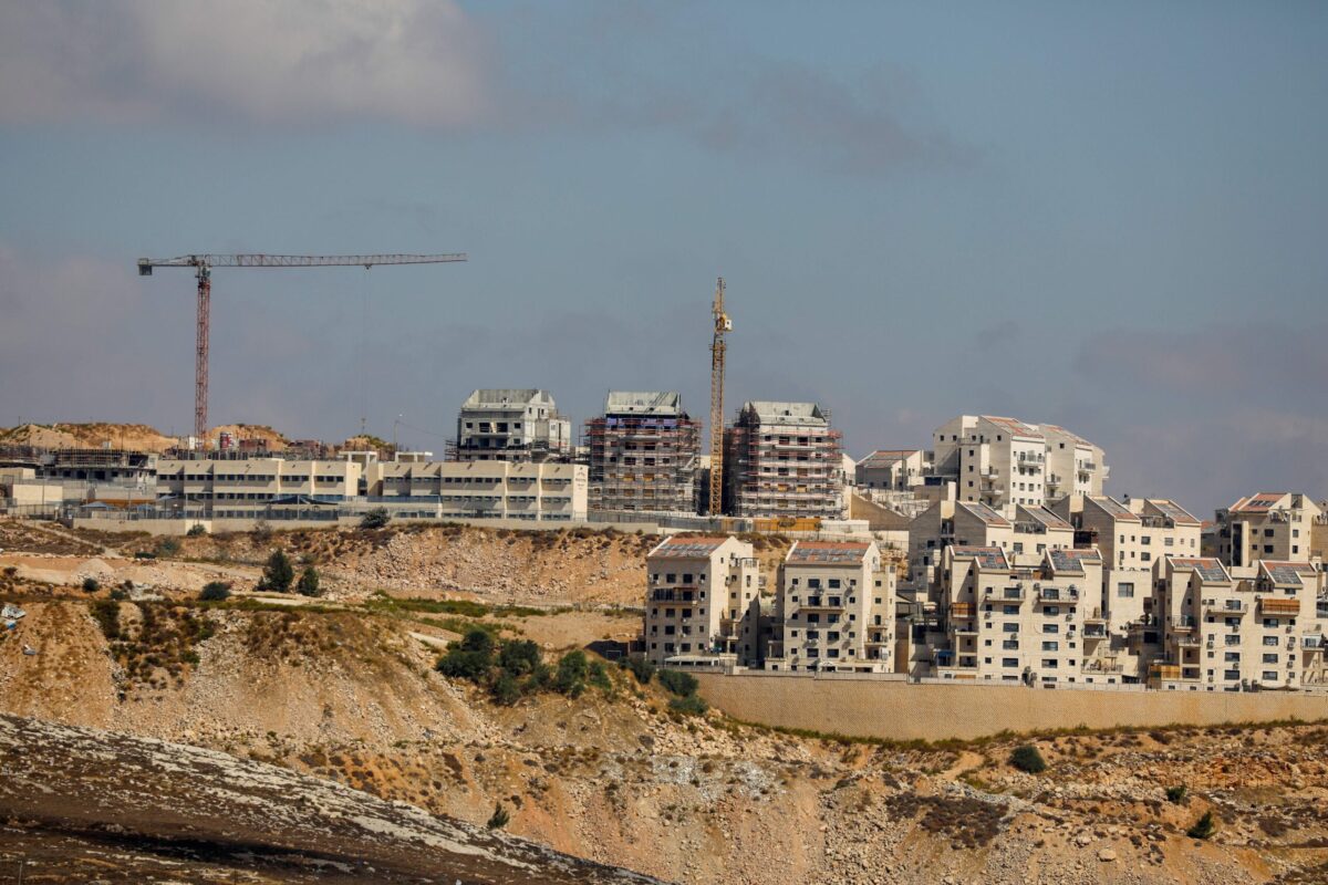 A picture taken on October 14, 2020 shows Israeli construction cranes at a building site of new housing units in the Jewish settlement of Kochav Yaakov, near the Palestinian city of Ramallah in the occupied West Bank [AHMAD GHARABLI/AFP via Getty Images]