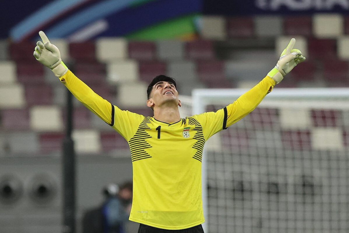 Iran's goalkeeper Alireza Beiranvand celebrates their win in the 2022 Qatar football World Cup Asian Qualifiers match between Iraq and Iran, at the al-Janoub Stadium in the Qatari city of Al Wakrah, on 7 September 2021. [KARIM JAAFAR/AFP via Getty Images]