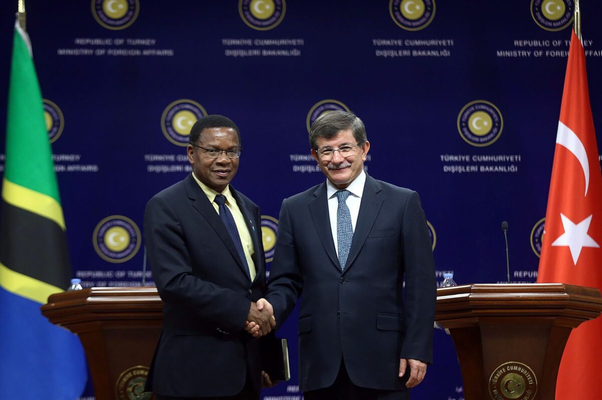 Turkish Foreign Affairs Minister Ahmet Davutoglu (R) shakes hands with Tanzanian Foreign Minister Bernard Membe (L) after a meeting in Ankara on May 8, 2014 [ADEM ALTAN/AFP via Getty Images]