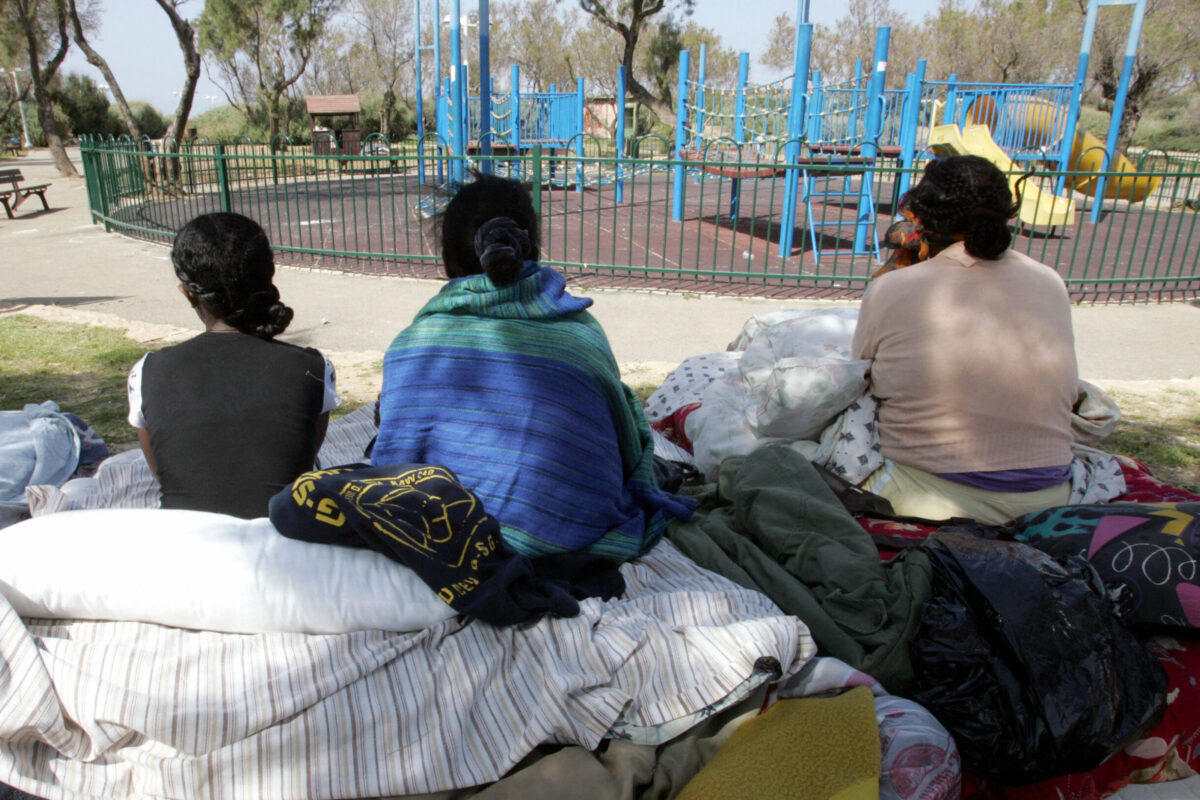 Eritrea refugees gather at a public garden on March 13, 2008 [JACK GUEZ/AFP via Getty Images]