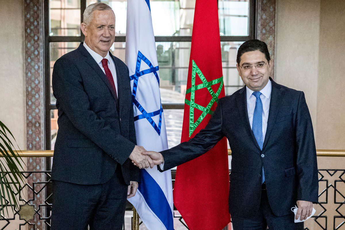 Morocco's Foreign Minister Nasser Bourita (R) shakes hands with Israel's Defence Minister Benny Gantz (L) in the capital Rabat on 24 November 2021 [FADEL SENNA/AFP/Getty Images]