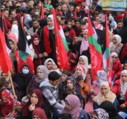 The Popular Front for the Liberation of Palestine commemorates its 54th anniversary in front of the Red Cross headquarters in Gaza, in solidarity with Palestinian prisoners held in Israeli jails on 13 December 2021 [Mohammed Asad/Middle East Monitor]