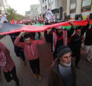 The Popular Front for the Liberation of Palestine commemorates its 54th anniversary in front of the Red Cross headquarters in Gaza, in solidarity with Palestinian prisoners held in Israeli jails on 13 December 2021 [Mohammed Asad/Middle East Monitor]