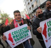 The Popular Front for the Liberation of Palestine commemorates its 54th anniversary in front of the Red Cross headquarters in Gaza, in solidarity with Palestinian prisoners held in Israeli jails on 13 December 2021 [Mohammed Asad/Middle East Monitor]