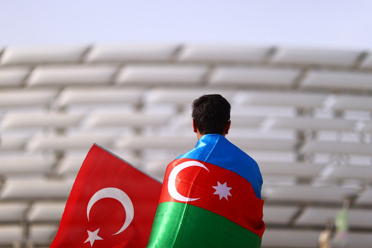 A Turkey fan wearing a Azerbaijan flag in Baku, Azerbaijan on 20 June 2021 [Francois Nel - UEFA/UEFA/Getty Images]