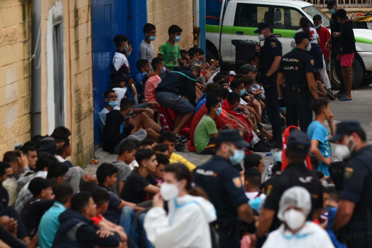 Migrant minors wait to be tested for COVID-19 upon their arrival to the Spanish enclave of Ceuta, on May 19, 2021 [ANTONIO SEMPERE/AFP via Getty Images]