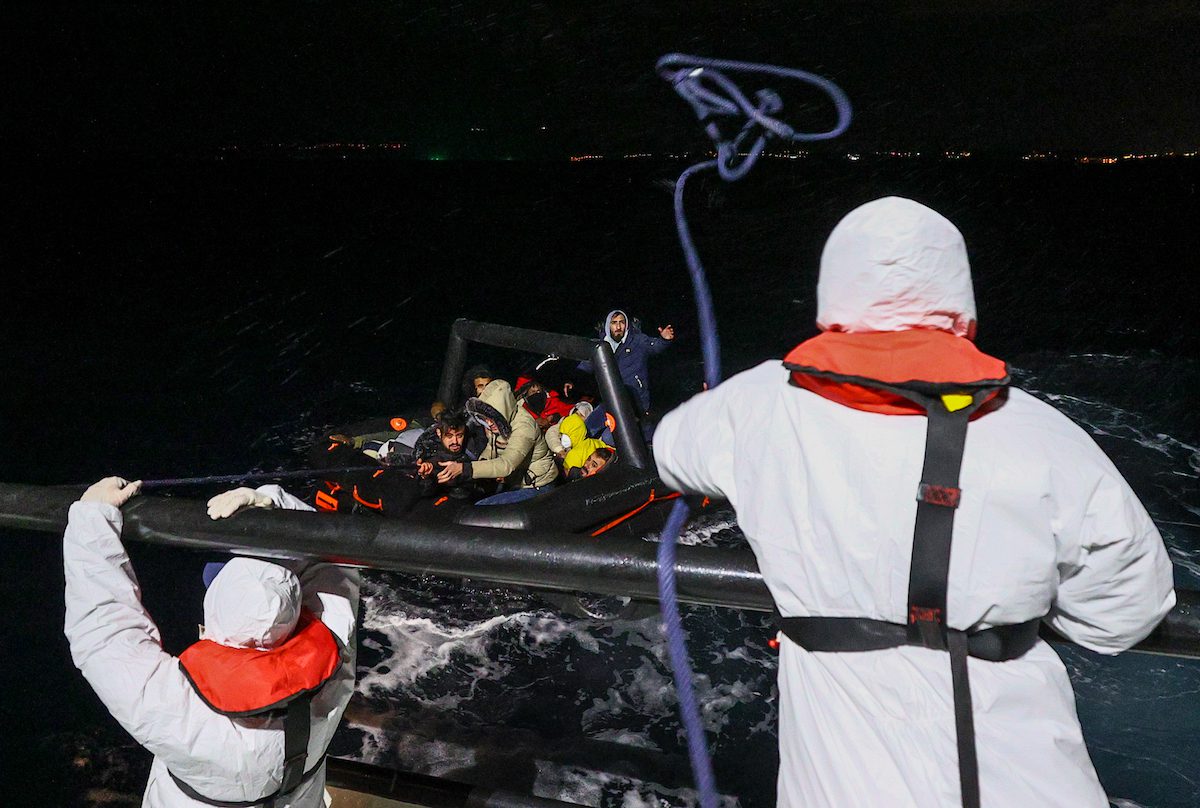 Migrants being rescued by Turkish coast guards after Greek forces illegally pushed them back into Turkey’s territorial waters in Izmir, Turkey on 24 December 2021 [Mehmet Emin Mengüarslan/Anadolu Agency]