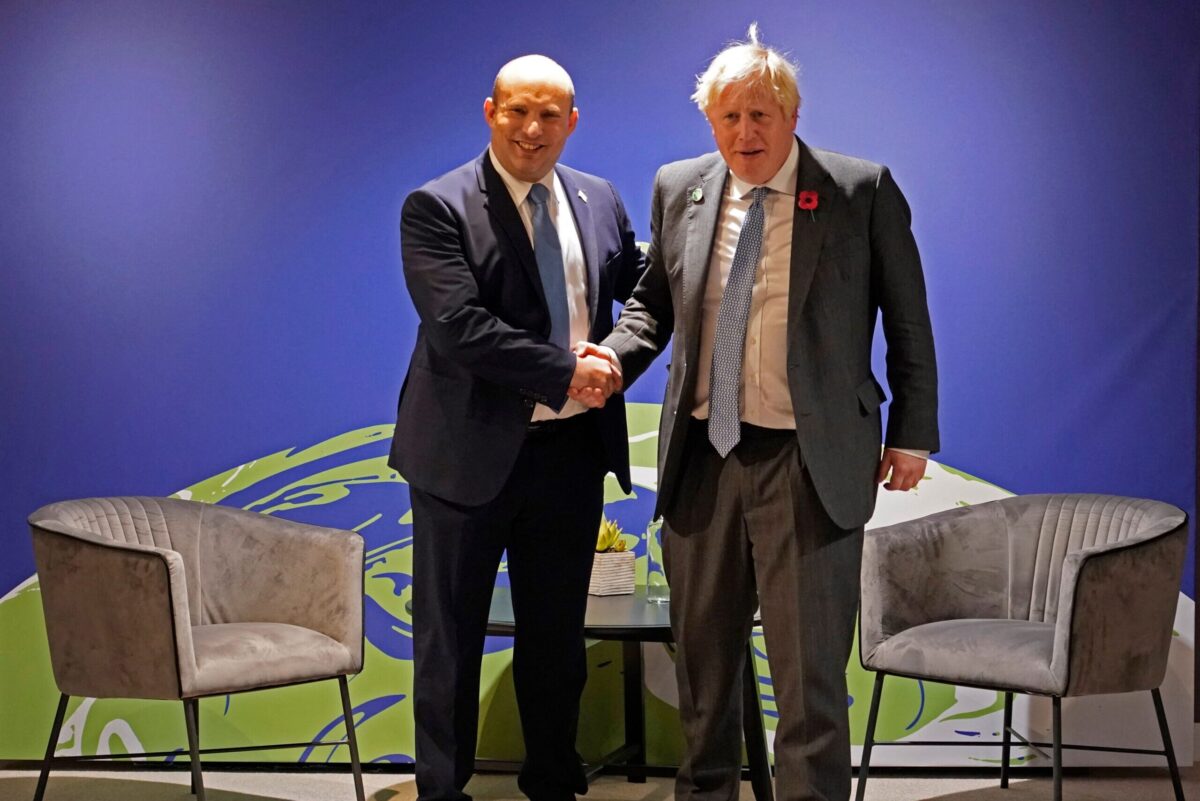 Britain's Prime Minister Boris Johnson (R) meets with Israel's Prime Minister Naftali Bennett on November 2, 2021 [ALBERTO PEZZALI/POOL/AFP via Getty Images]