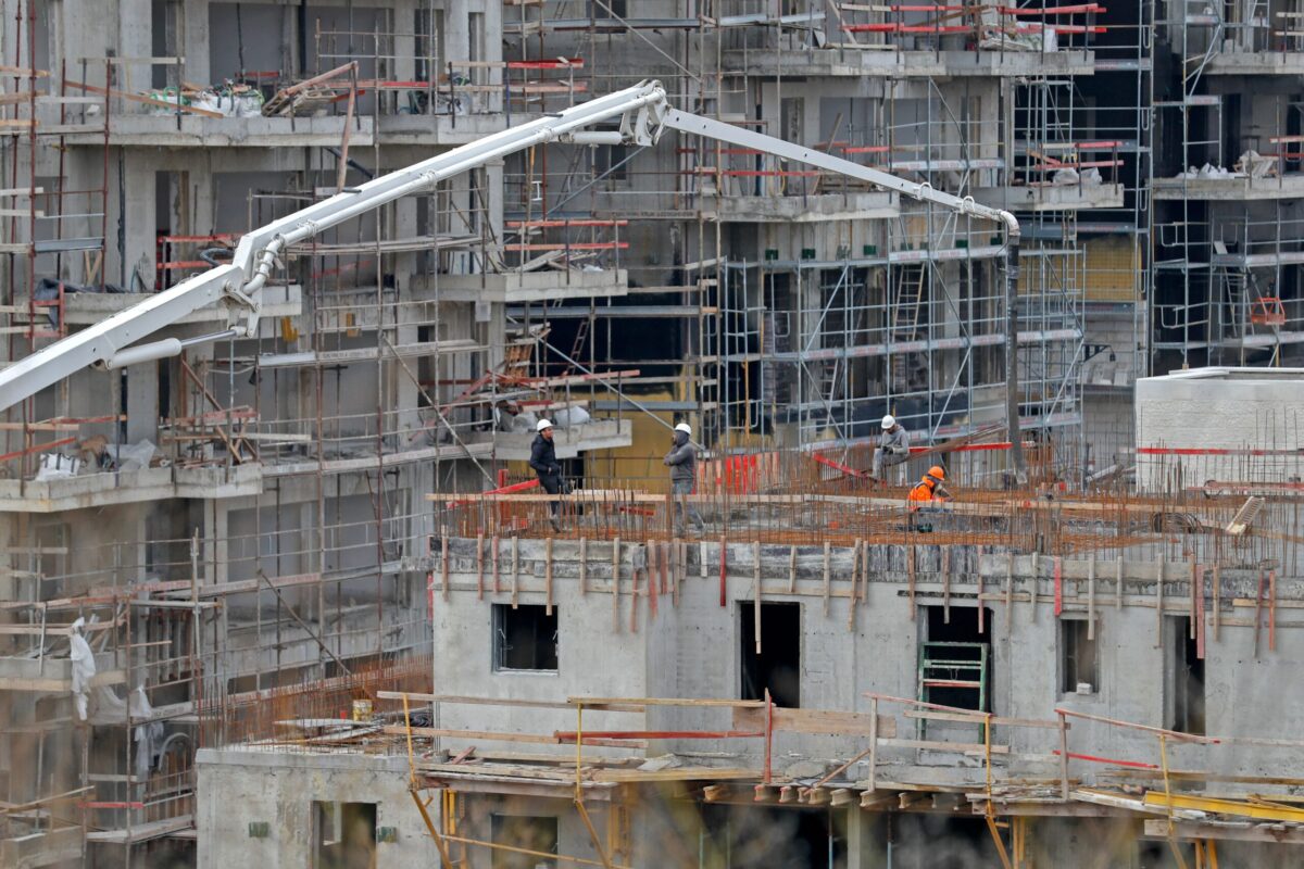 A partial view taken on January 5, 2022 shows ongoing construction work at Ramat Shlomo, a Jewish settlement in the Israeli-annexed eastern sector of Jerusalem [AHMAD GHARABLI/AFP via Getty Images]