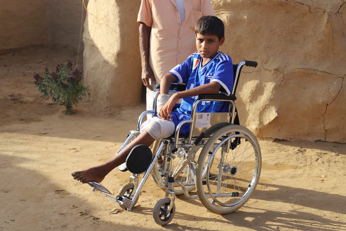 12-year-old Raid Cerebhi, who lost his right leg by stepping on a mine trapped by the Houthis while grazing his sheep, is seen on a wheelchair in Azle Beni Fayid village of Hajjah, Yemen on February 05, 2022 [Mohammed Al-Wafi - Anadolu Agency]