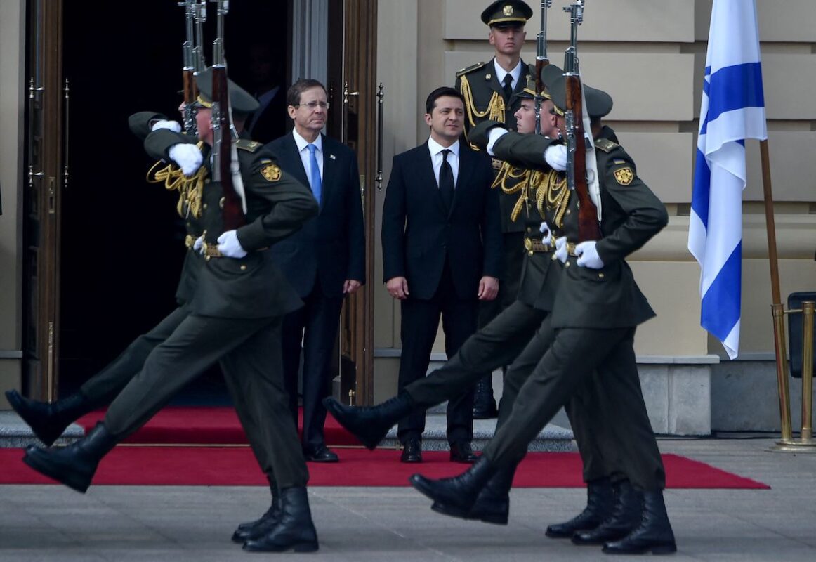 Ukrainian President Volodymyr Zelensky (R) and his Israeli counterpart Isaac Herzog review a guard of honour ahead of their meeting at Mariinskyi Palace in Kiev on October 5, 2021. [SERGEI SUPINSKY/AFP via Getty Images]