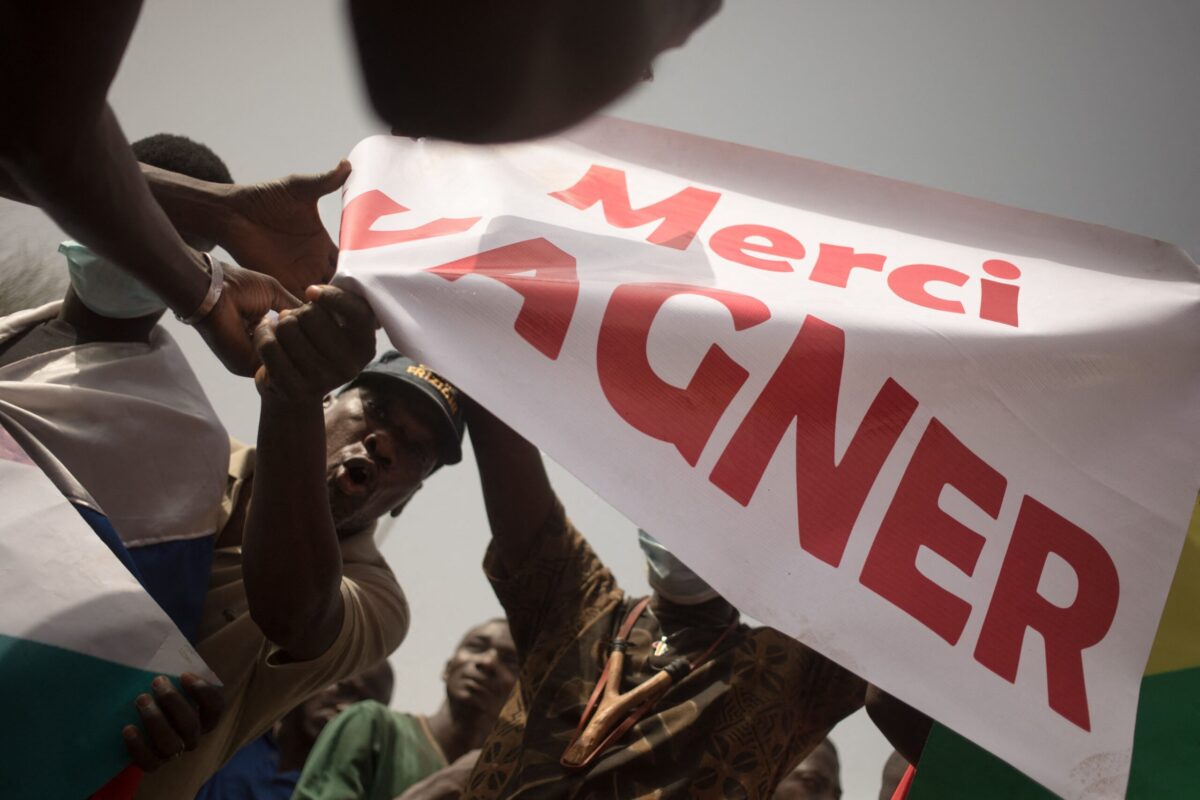 Protesters holds a banner reading "Thank you Wagner", the name of the Russian private security firm present in Mali, during a demonstration organised by the pan-Africanst platform Yerewolo to celebrate France's announcement to withdraw French troops from Mali, in Bamako, on February 19, 2022. - The French president announced on Febraury 16 the withdrawal of troops from Mali after a breakdown in relations with the nation's ruling military junta. France first intervened in Mali in 2013 to combat a jihadist insurgency that emerged one year prior. The French pull-out after nearly a decade is also set to see the smaller European Takuba group of special forces, created in 2020, leave Mali. (Photo by FLORENT VERGNES / AFP) (Photo by FLORENT VERGNES/AFP via Getty Images)