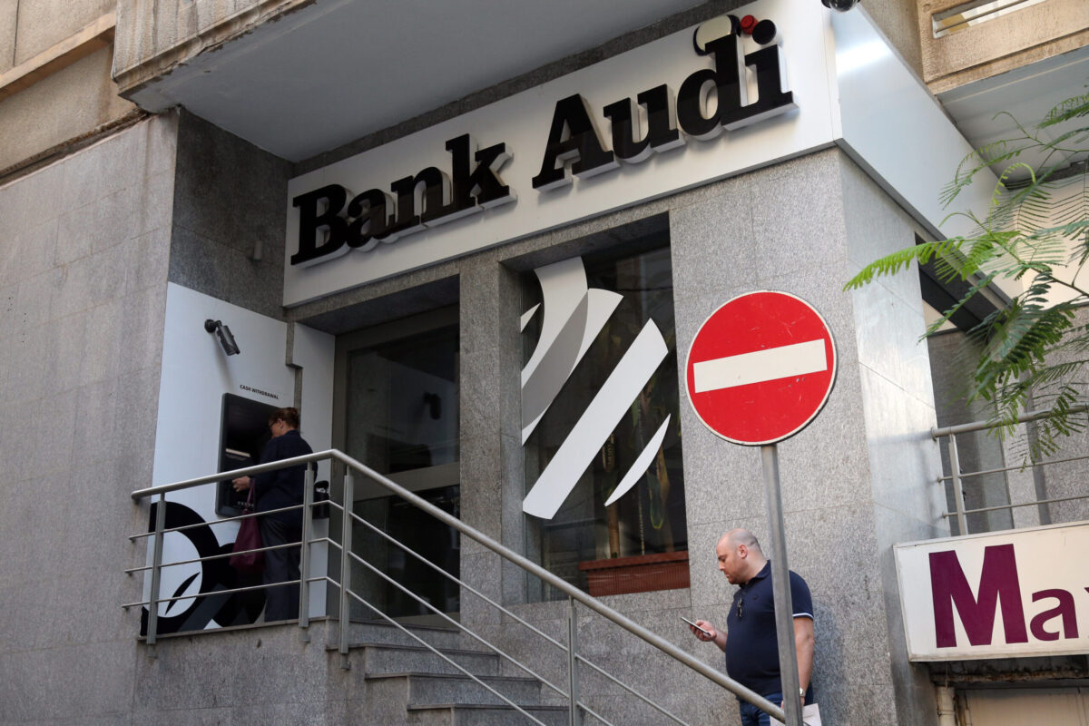 Customers use an automated teller machine (ATM) outside an Audi Bank SAL bank branch in Beirut, Lebanon, on October 30, 2019 [Hasan Shaaban/Bloomberg via Getty Images]