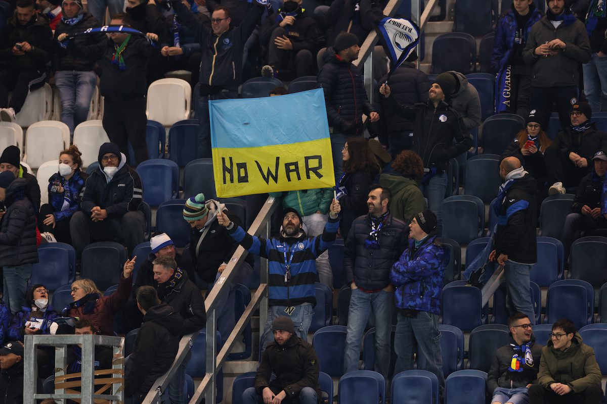 An Atalanta fan holds up a Ukraine flag bearing the words No War during the Serie A match between Atalanta BC and UC Sampdoria at Gewiss Stadium on 28 February 2022 in Bergamo, Italy. [Jonathan Moscrop/Getty Images]
