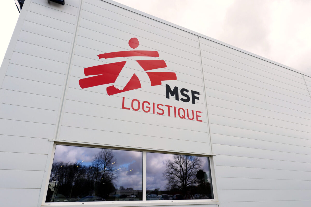 The new logistics platform and the group's logo of Medical aid group Doctors Without Borders (MSF) are seen in Merignac, near Bordeaux' airport, on March 13, 2015. AFP PHOTO / JEAN-PIERRE MULLER / AFP / JEAN-PIERRE MULLER AND - (Photo credit should read JEAN-PIERRE MULLER/AFP via Getty Images)