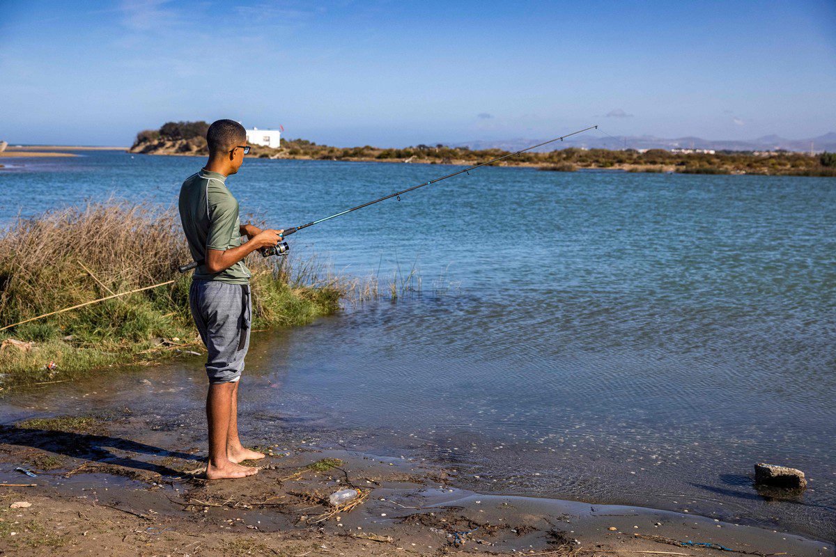A man fishes in the river of Moulouya in Morocco on 2 November 2021 [FADEL SENNA/AFP/Getty Images]