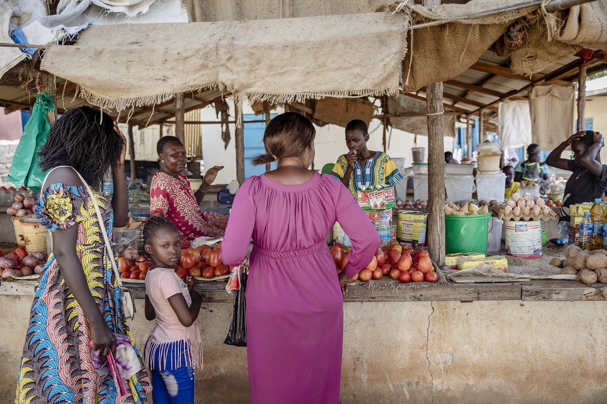 Customers queue at a stall in South Sudan, on 6 June 2021 [Adrienne Surprenant/Bloomberg via Getty Images]