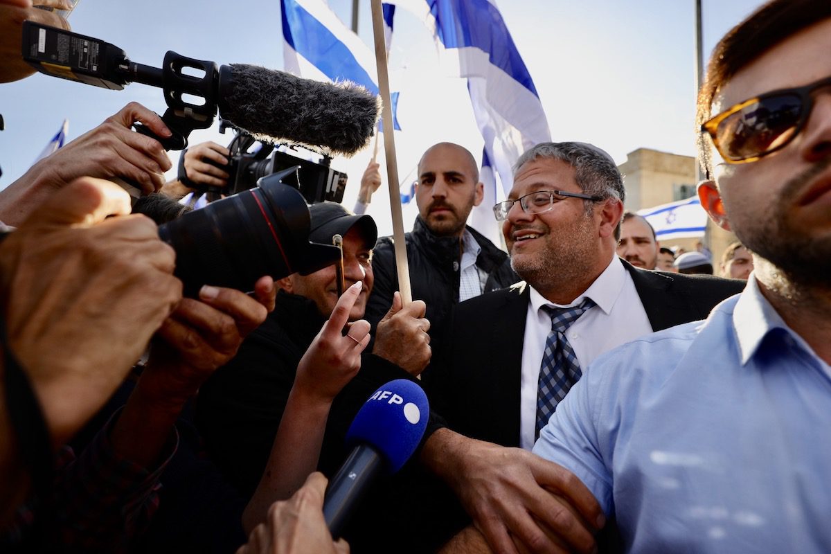Far-right Knesset member Itamar Ben Gvir attends a "flag march" in West Jerusalem on April 20, 2022. [Mostafa Alkharouf - Anadolu Agency]