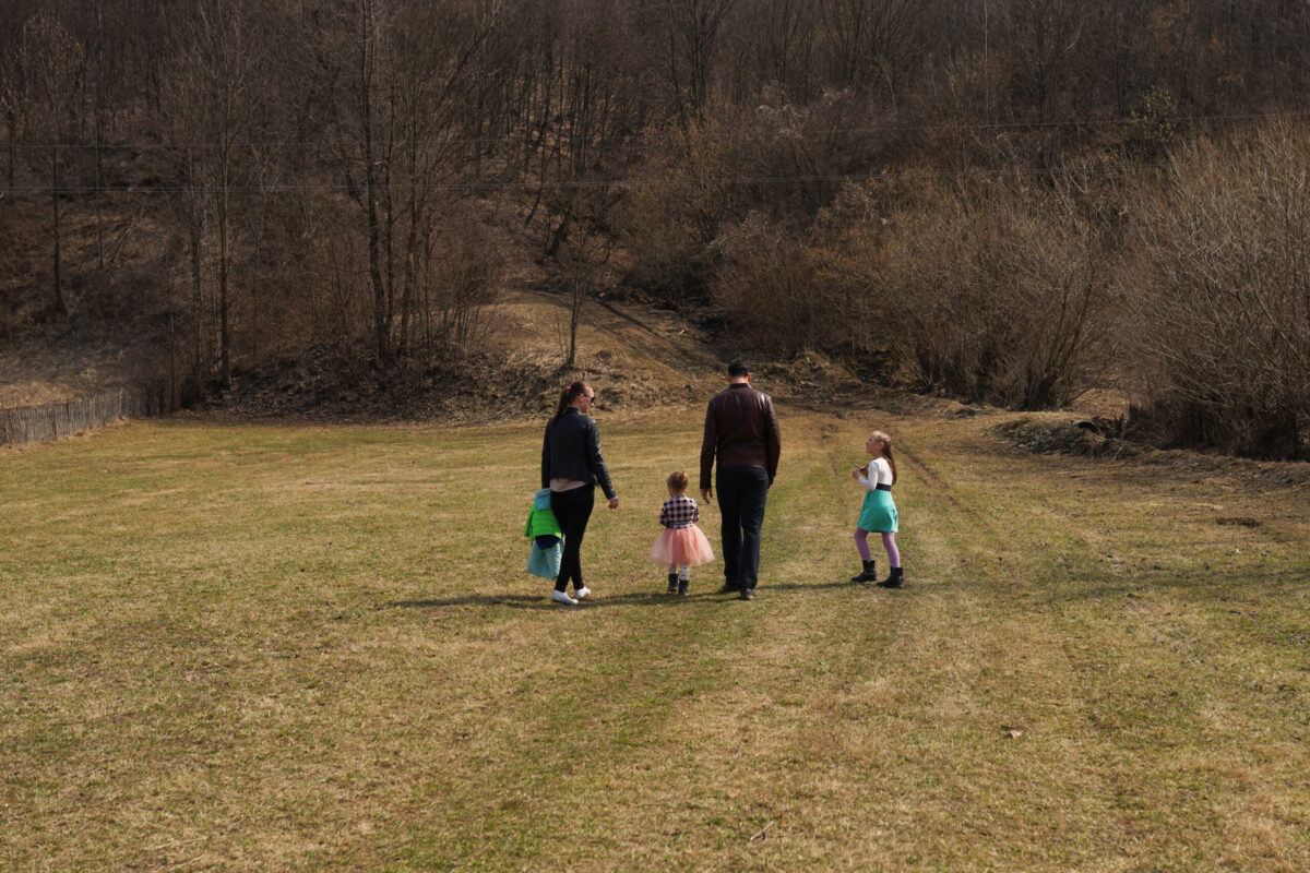 A Ukrainian family who fled the war in Ukraine and are being hosted at the "Saint John the Baptist" Monastery in Ruscova, go for a walk, on March 30, 2022 in Ruscova, Romania [Andreea Campeanu/Getty Images]