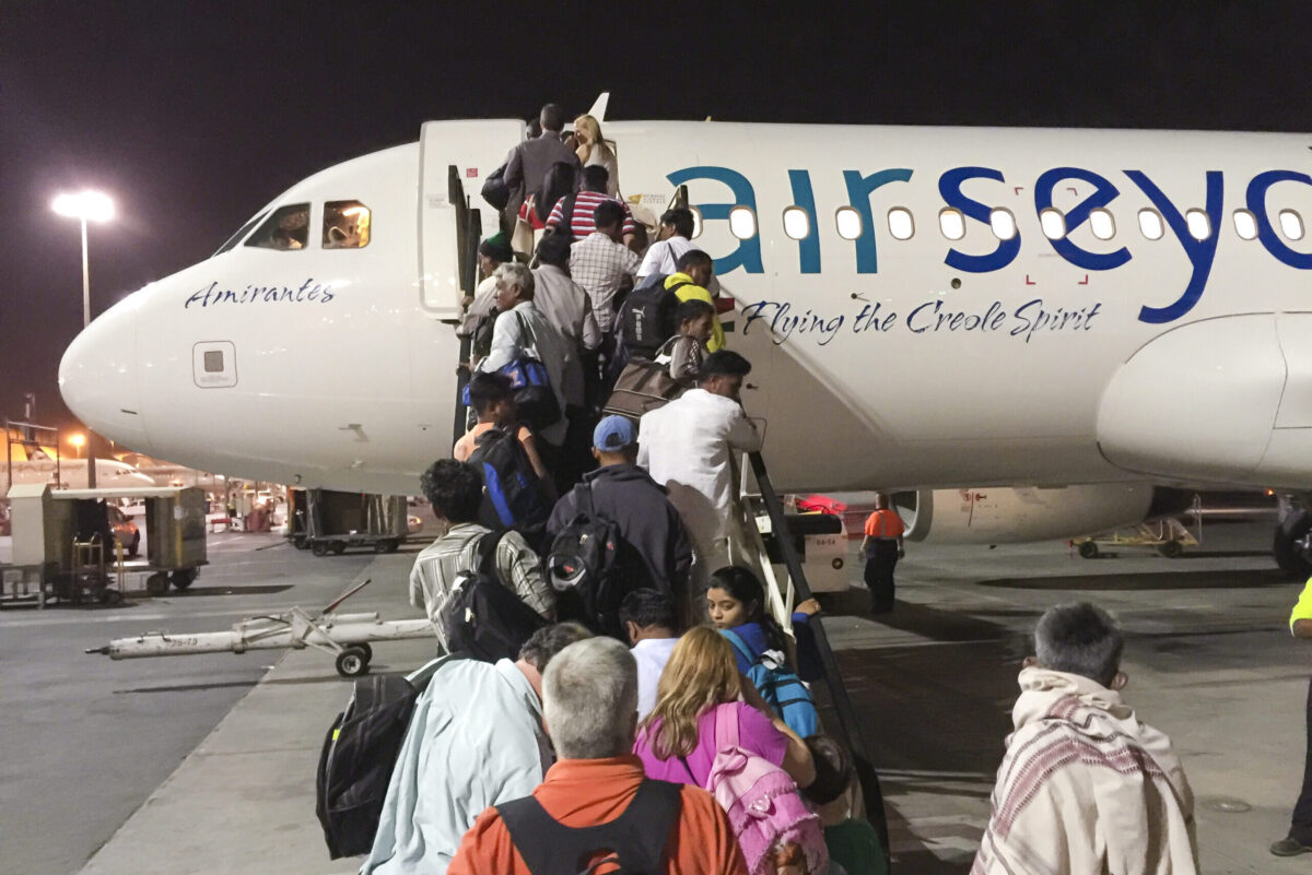 ABU DHABI, UNITED ARAB EMIRATES - SEPTEMBER 22, 2015: Tourists at departure to Mahe with Air Seychelles on September 22, 2015 in Abu Dhabi, United Arab Emirates. (Photo by EyesWideOpen/Getty Images)