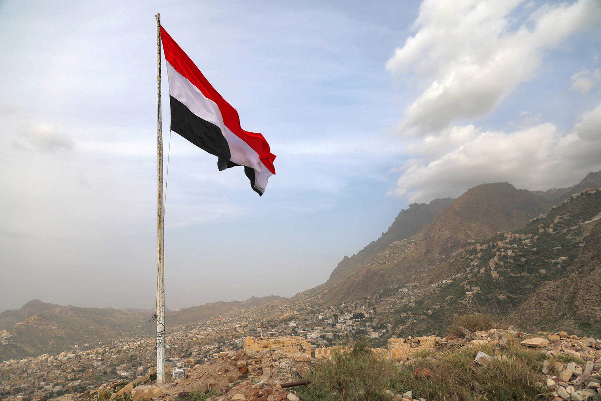 A Yemeni flag waves in the city of Taez, on 18 July 2021 [AHMAD AL-BASHA/AFP/Getty Images]