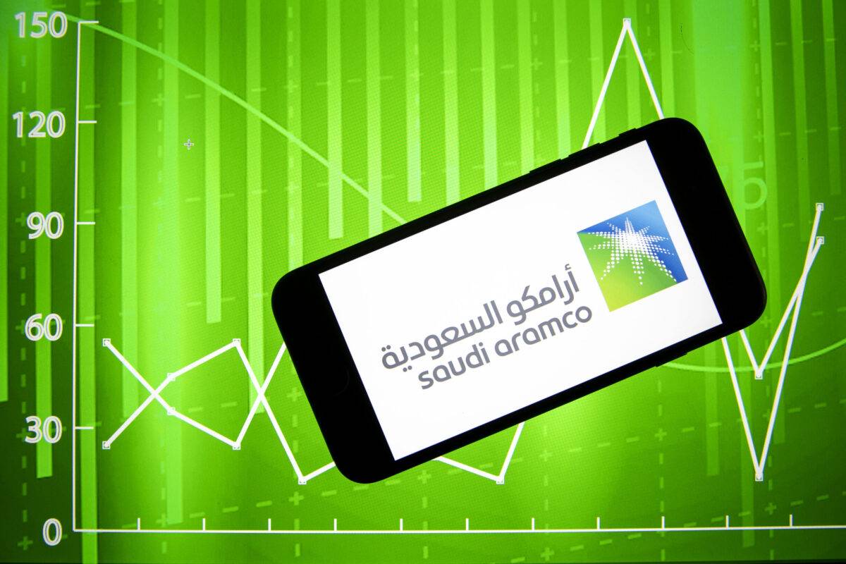  In this photo illustration the logo of "Saudi Aramco", the national oil and gas company of Saudi Arabia, is displayed on a mobile phone screen and financial stock market graph is displayed on a computer screen in Ankara, Turkiye on May 12, 2022 [Ali Balıkçı/Anadolu Agency]