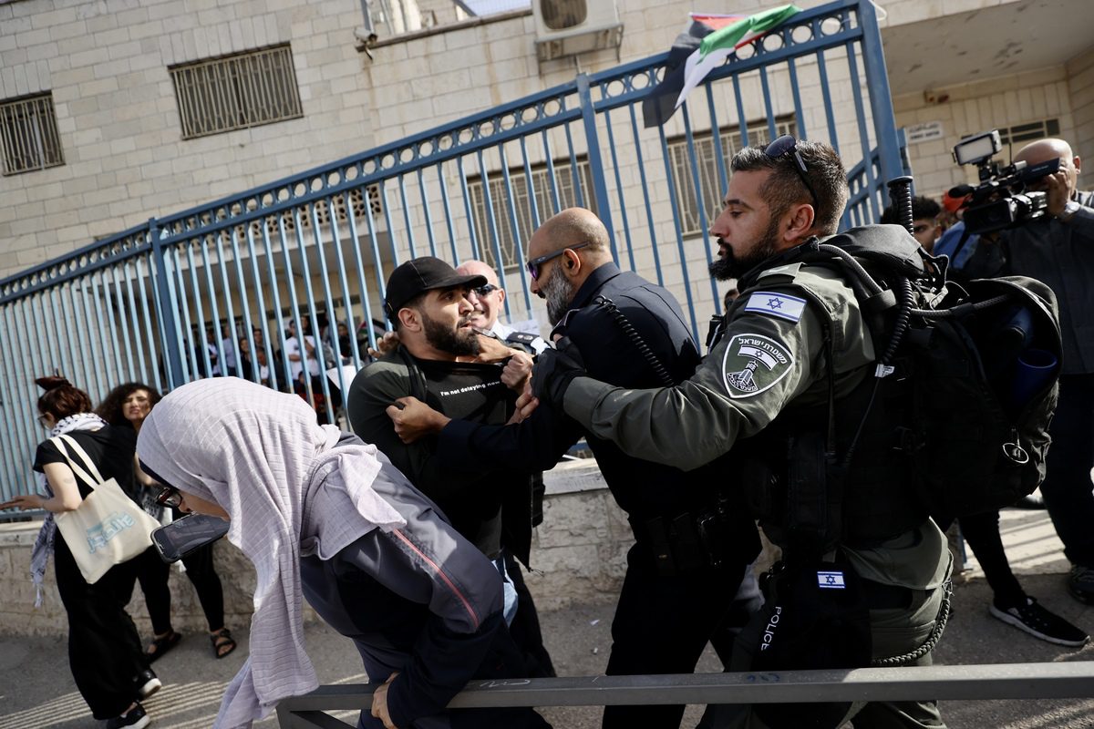 Israeli forces take a Palestinian into custody in West Bank, on May 12, 2022, in East Jerusalem [Mostafa Alkharouf/Anadolu Agency]