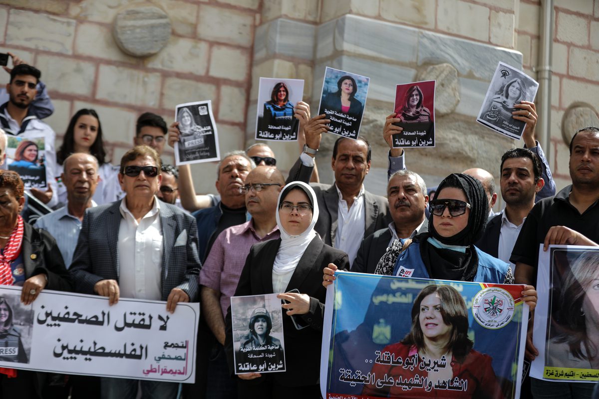 Muslim and Christian demonstrators gather to protest held at the Saint Porphyrius Church in Gaza City, Gaza on May 15, 2022, upon the call of the Palestinian Journalists' Union and the Council of Representatives of the Arab Orthodox Church for reporter Shireen Abu Akleh, who died as a result of fire opened by Israeli soldiers during a raid in the Jenin refugee camp. [Ali Jadallah - Anadolu Agency]