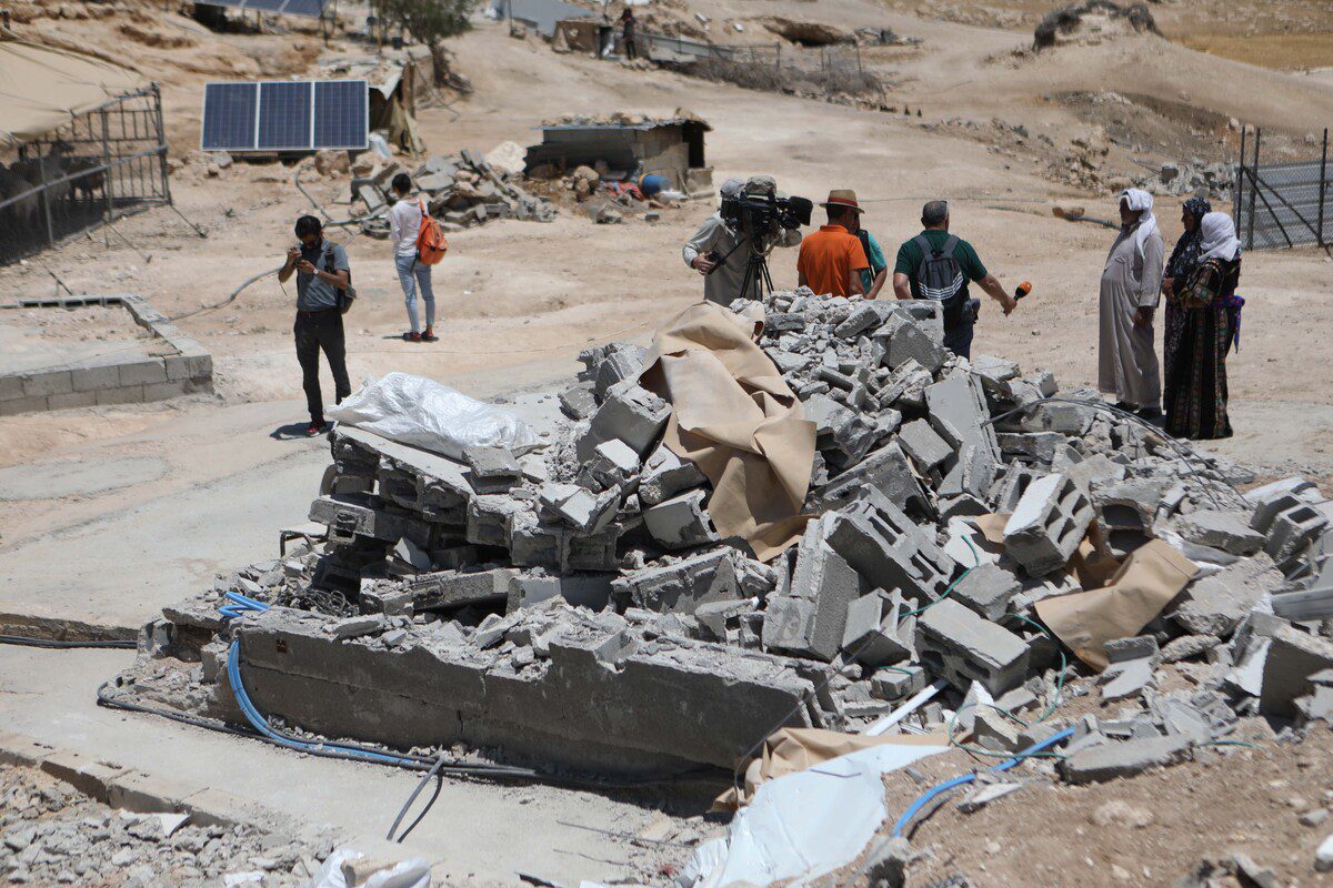 Members of Palestinian Masafer Yatta communities rebuild their home territory which has been destroyed by Israeli occupation forces [Mamoun Wazwaz /Anadolu Agency]